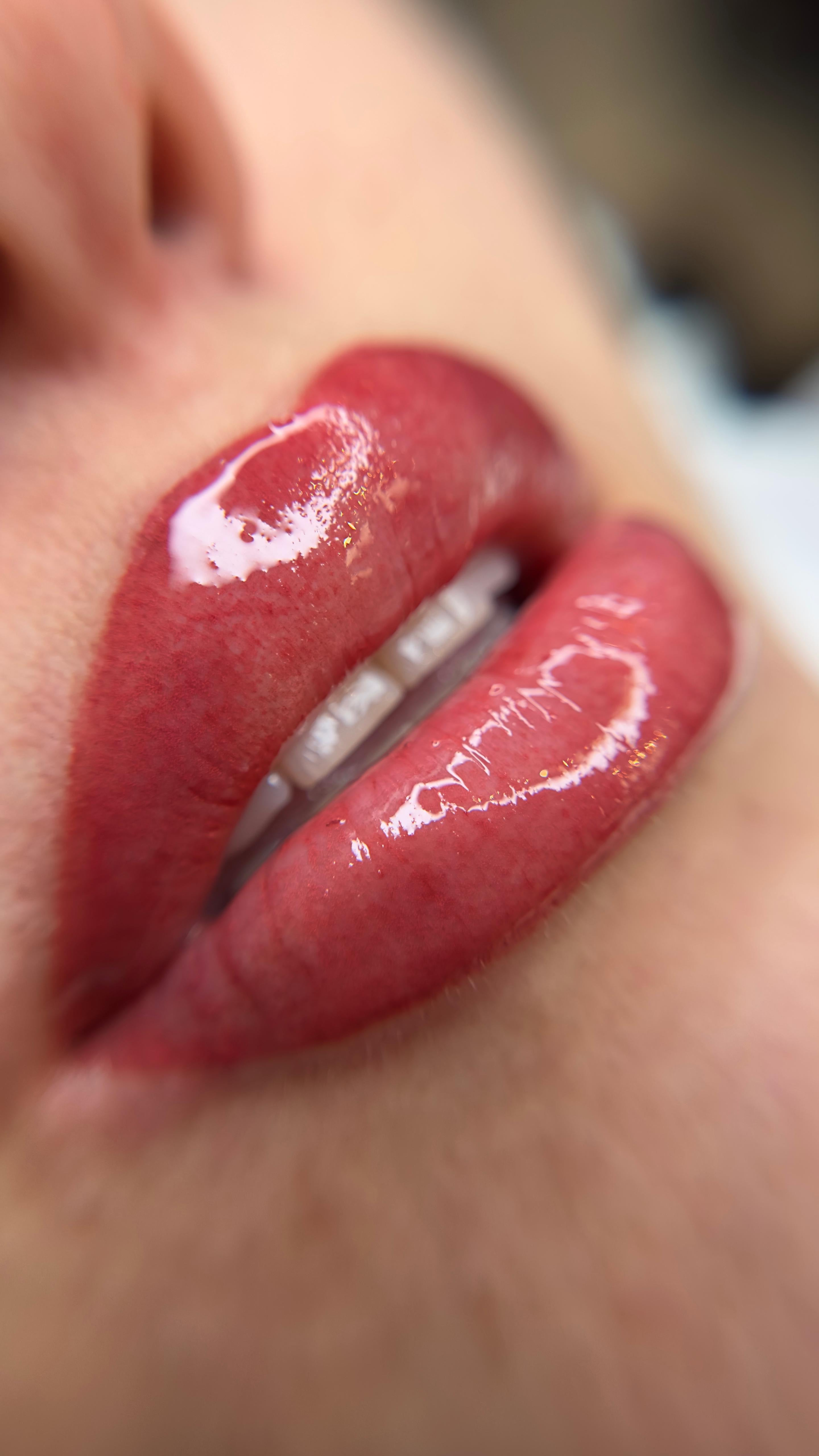 Close-up of freshly applied lip blushing with a glossy finish at ME Beauty Bar.