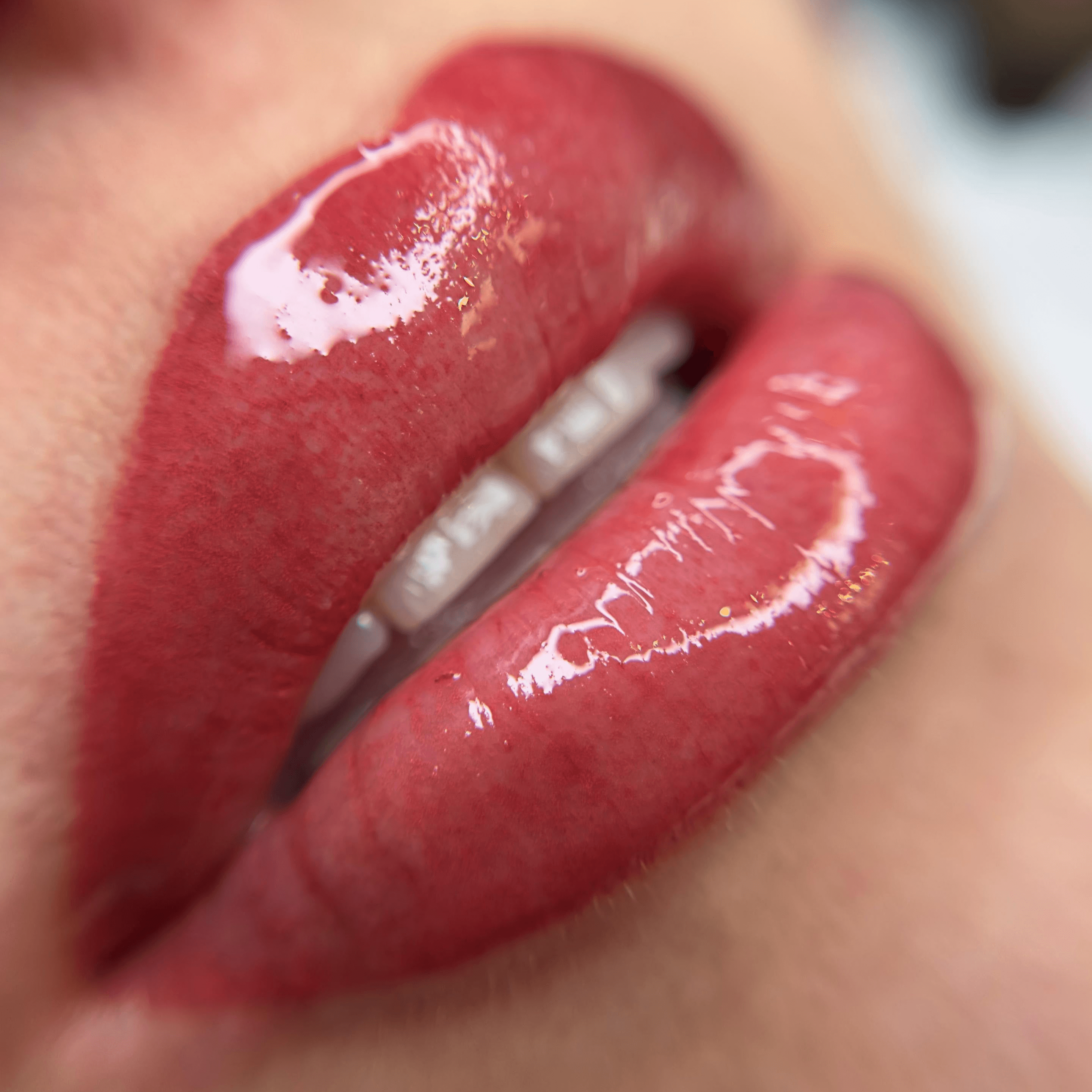 Close-up of freshly applied lip blushing with a glossy finish at ME Beauty Bar.