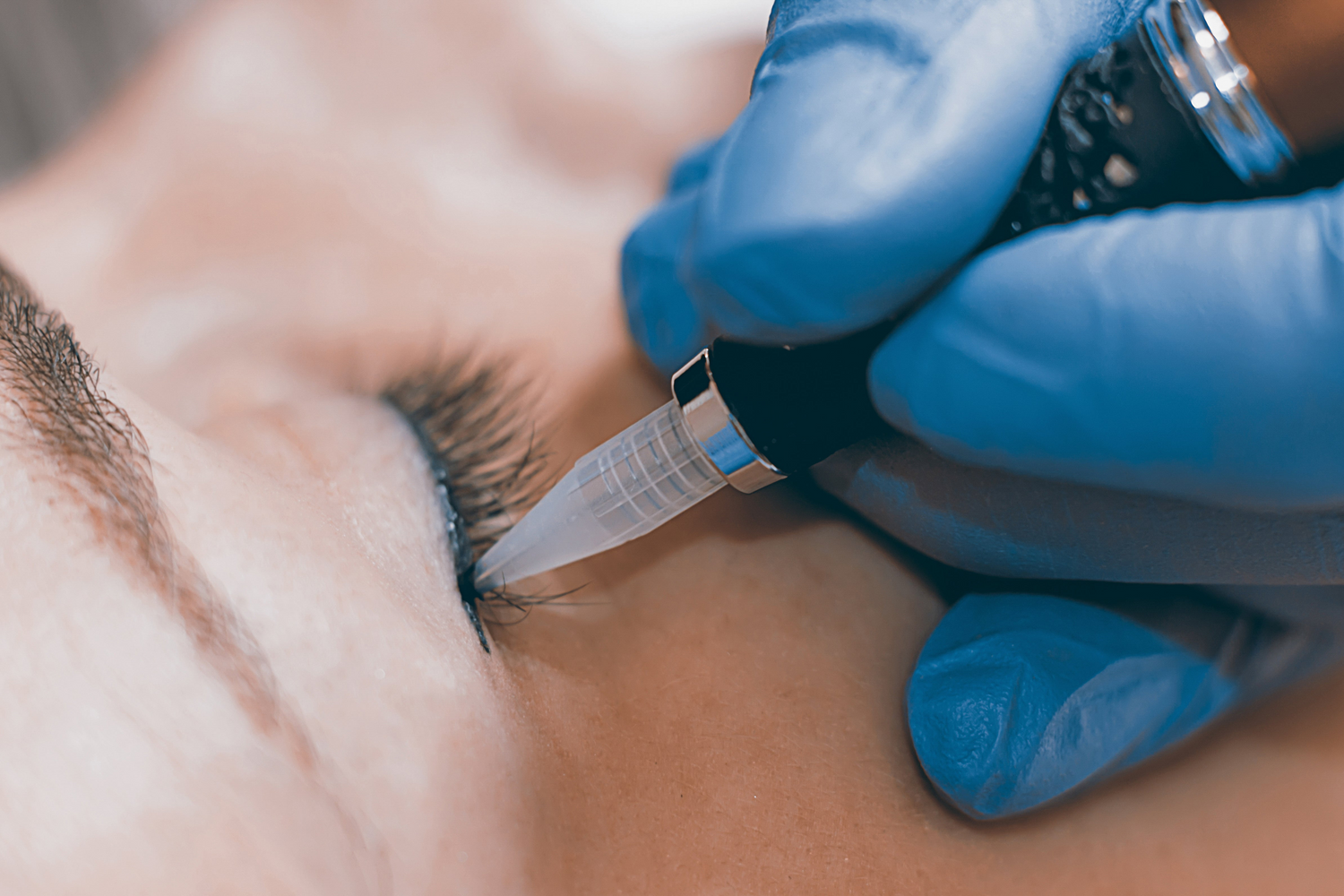 Permanent eyeliner procedure in progress at ME Beauty Bar.