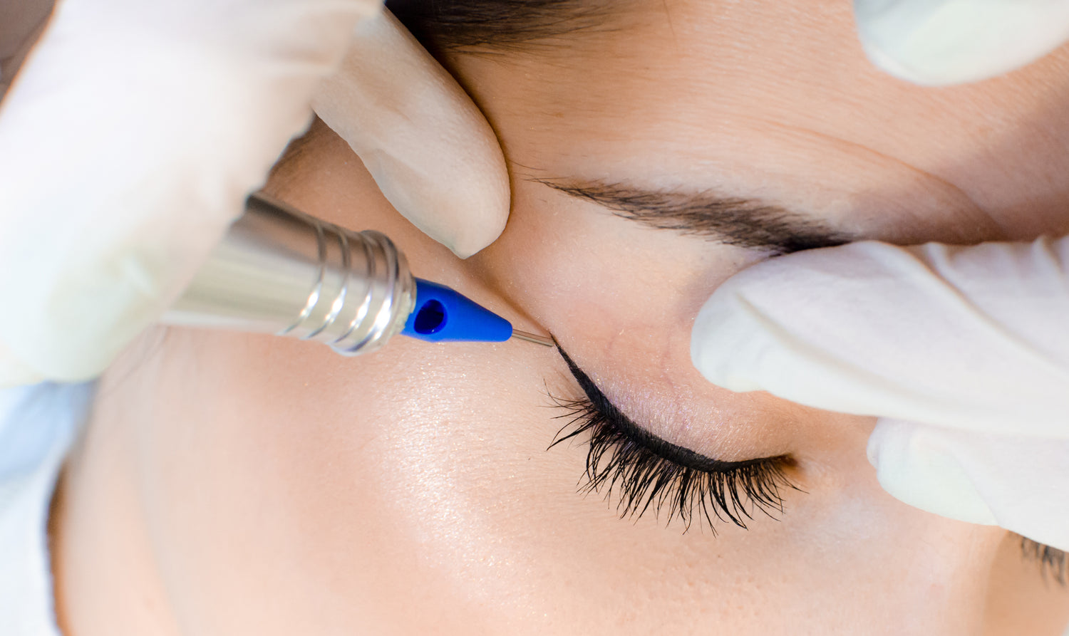 Permanent eyeliner application in progress at ME Beauty Bar.